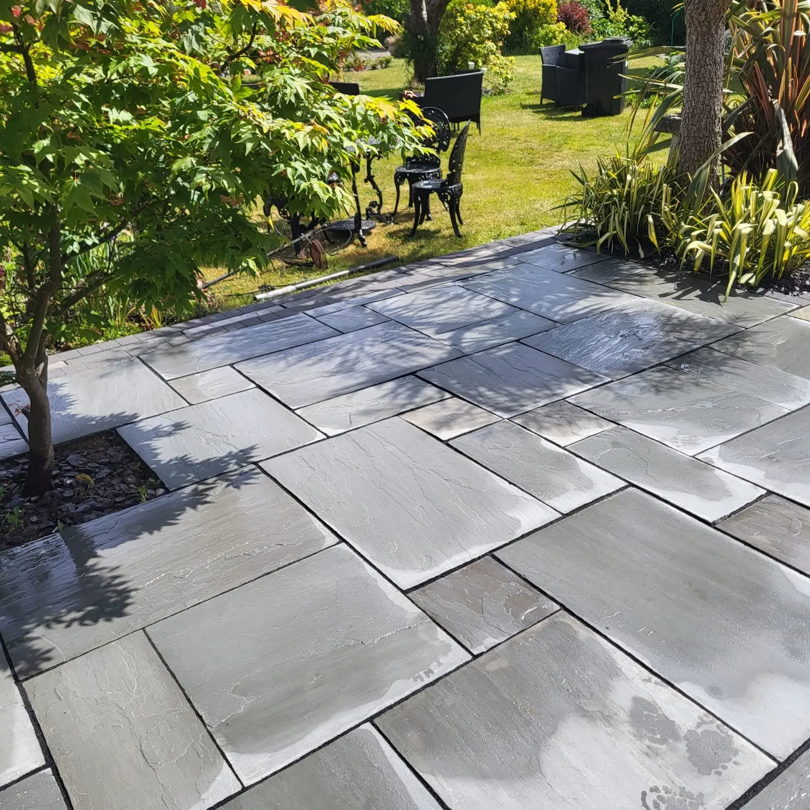 Grey sandstone patio cleaned back to bare stone